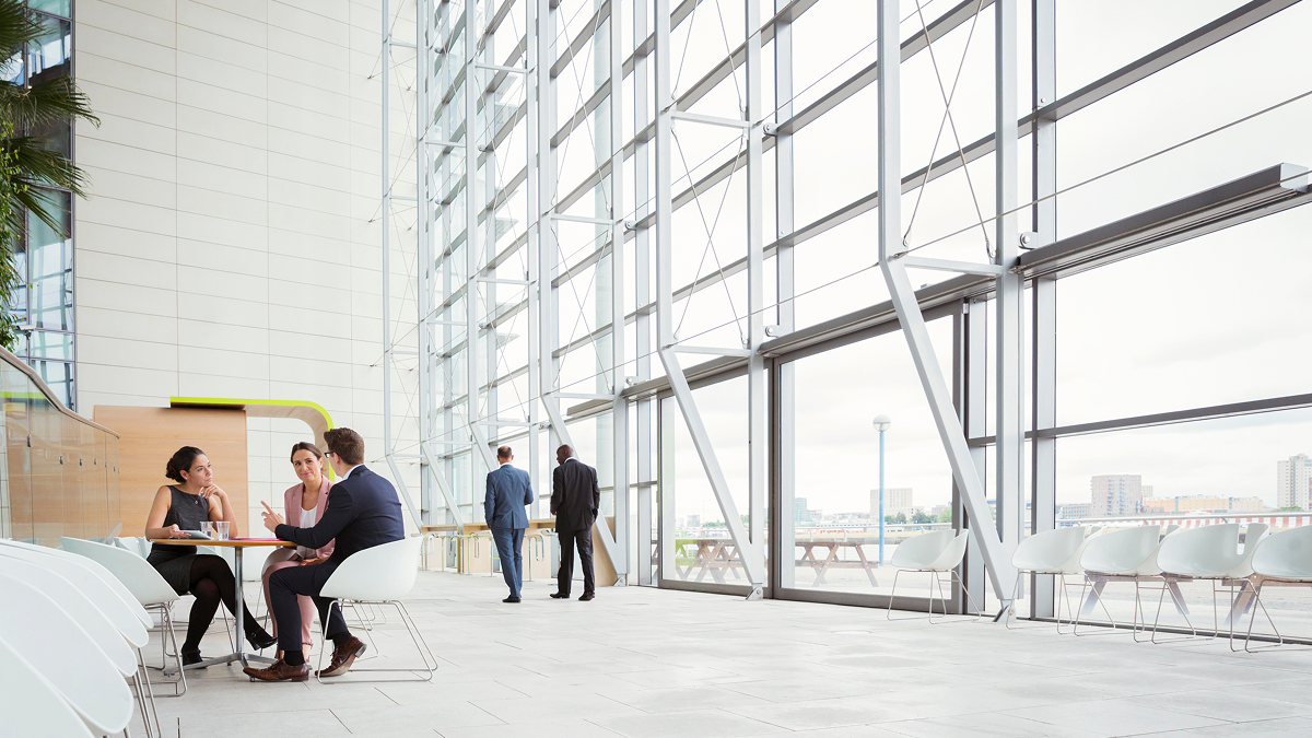 colleagues sitting in office lobby