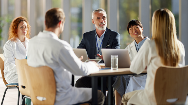 businesspeople talking in lobby hallway