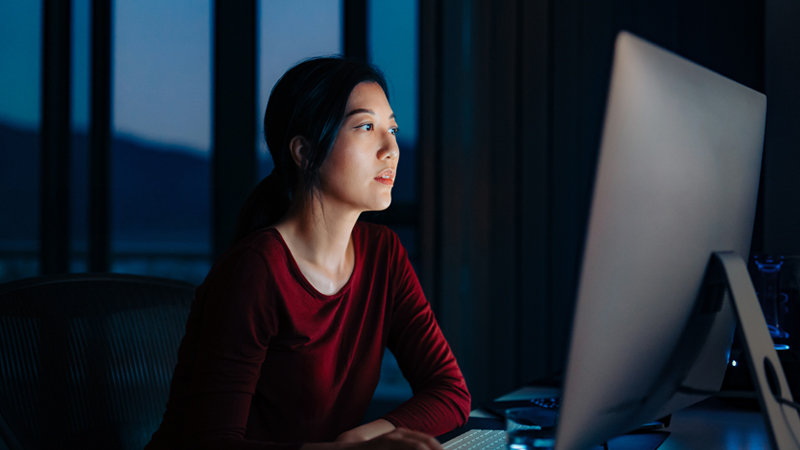 woman looking at computer screen