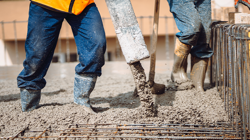 workers pouring concrete