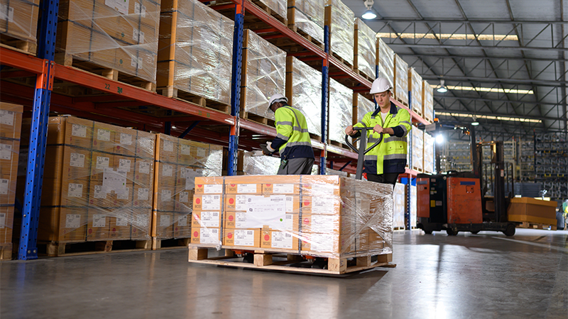 workers in warehouse with inventory