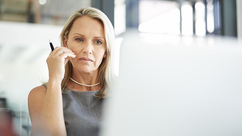 Telemarketing Scams woman looking at computer