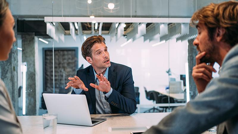 Investment Insights business person talking to colleagues