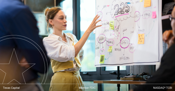 woman presenting in front of whiteboard