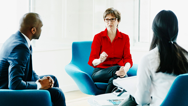 three colleague talking
